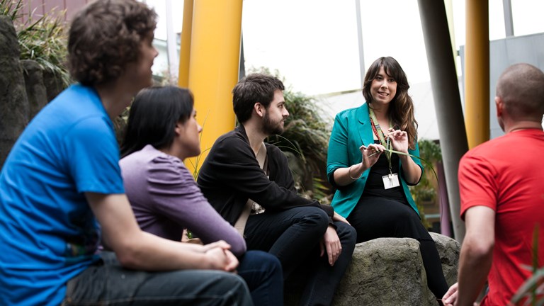 Staff member talking to visitors in Milarri Garden