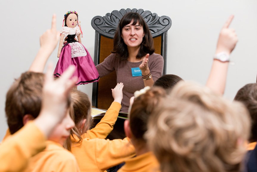 A museum staff member running an education program