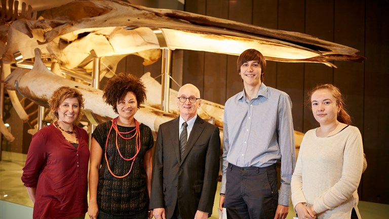 Dr Robin Hirst with the four recipients of the 1854 Student Scholarships for 2016, in front of the blue whale skeleton. 