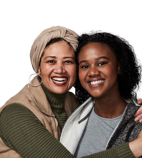 Portrait of two women, smiling and embracing