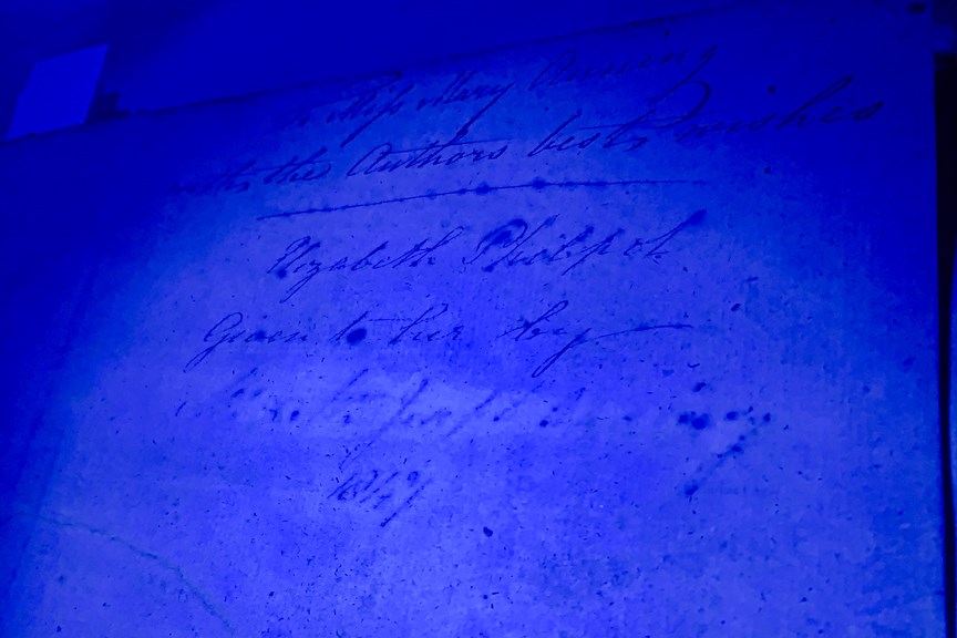 A photo of a book under UV light