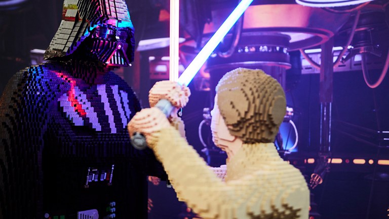 The Sith Lord Darth Vader and Jedi Luke Skywalker crossing lightsabers in a duel LEGO for LEGO® Star Wars: The Exhibition at Melbourne Museum.