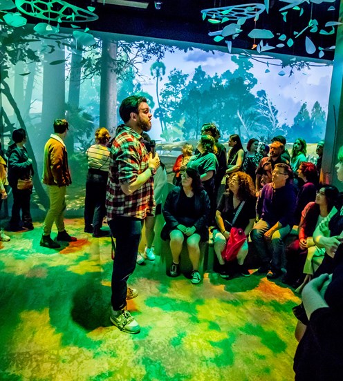 A man gives a talk in the Triceratops exhibition.